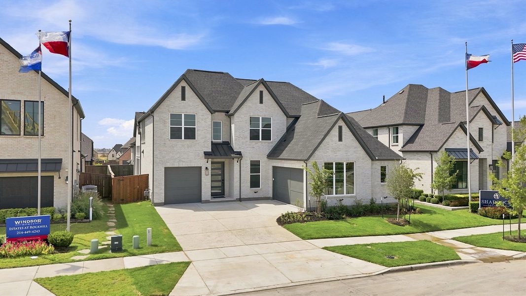 Front exterior of a new home in Estates at Rockhill, Frisco, TX, highlighting curb appeal (Image 23). Front exterior of a new home in Estates at Rockhill, Frisco, TX, highlighting curb appeal (Image 23).