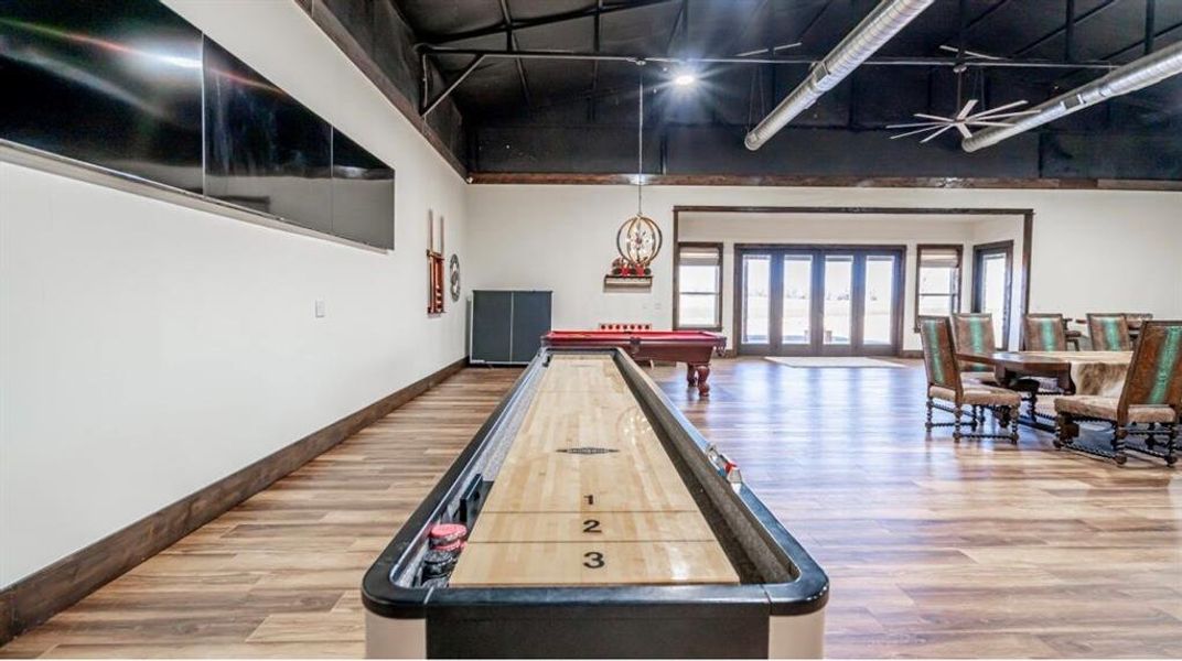 Recreation room with billiards and a high ceiling Recreation room with billiards and a high ceiling