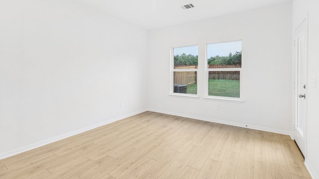 Spacious, unfurnished interior of a new home in Bar W Ranch, Leander (Image 23).