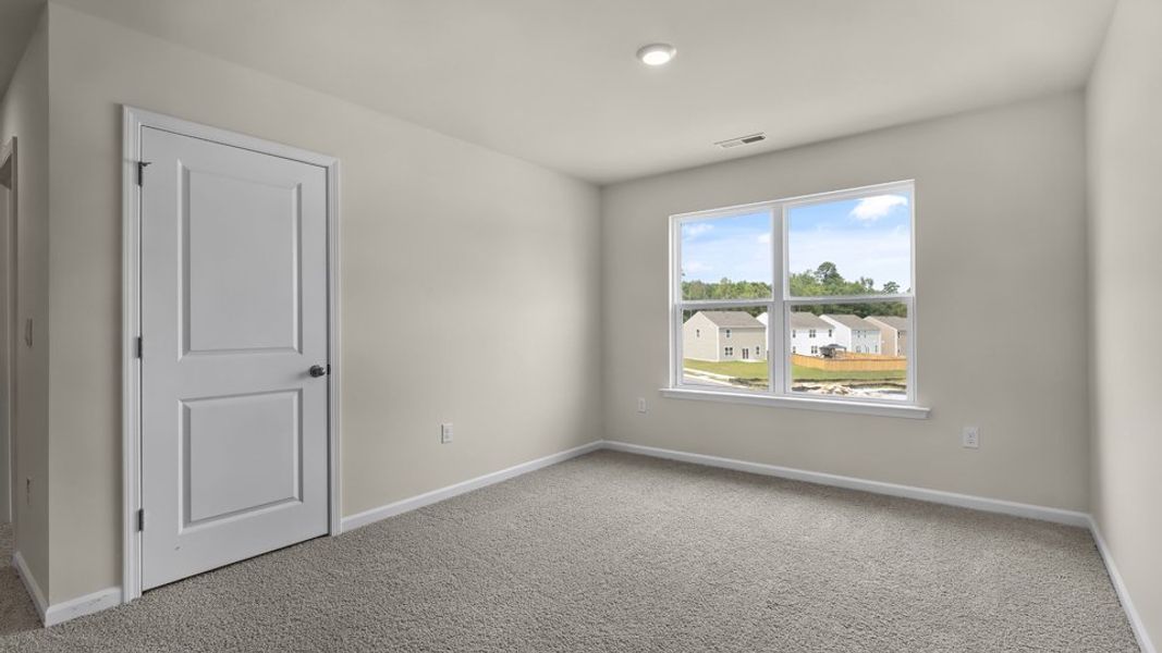 Spacious, unfurnished interior of a new home in Anderson Farm, Wendell (Image 24).
