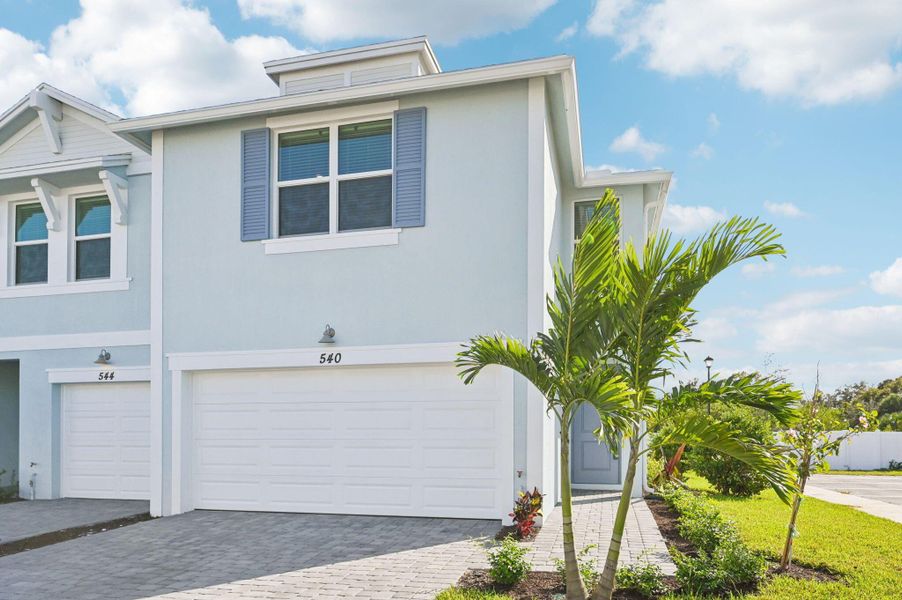 Front exterior of a new home in Tidewater, Fort Pierce, FL, highlighting curb appeal (Image 20).