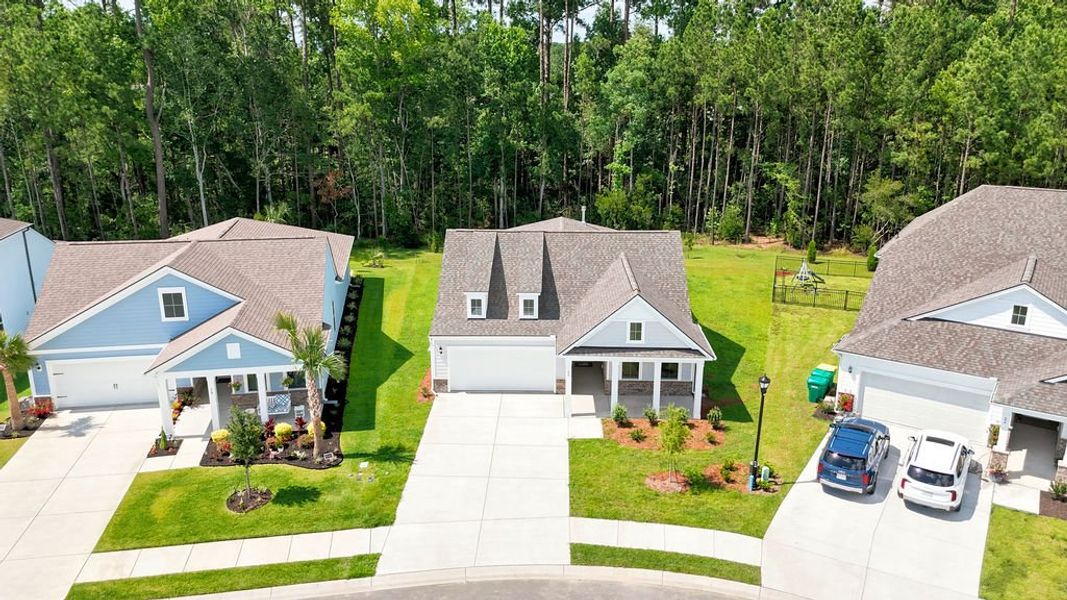 Front exterior of a new home in Midpoint at New Riverside, Bluffton, SC, highlighting curb appeal (Image 26). Front exterior of a new home in Midpoint at New Riverside, Bluffton, SC, highlighting curb appeal (Image 26).
