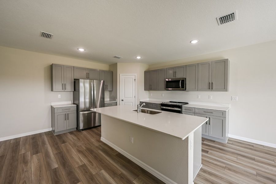 Furnished interior view inside a new home in Pasadena Ridge, Dade City (Image 3).