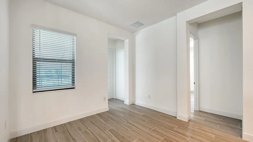 Spacious, unfurnished interior of a new home in Palm Grove Real Estate and Homes for Sale in Lakewood Ranch, FL - Neal Communities, Bradenton (Image 16).