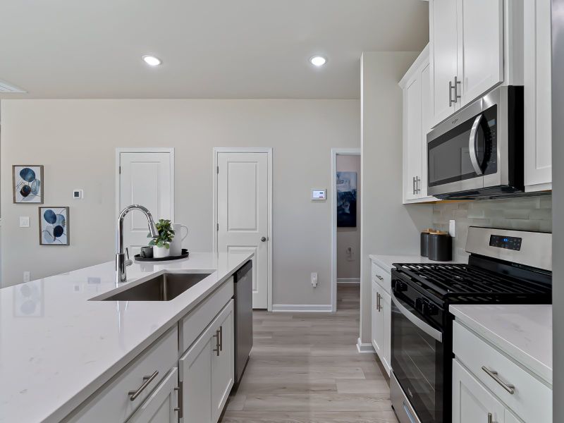 A large kitchen island overlooks the sprawling great room, perfect for entertaining.