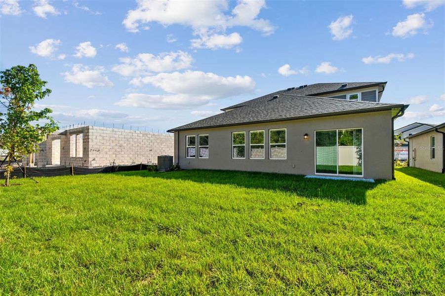 Exterior details and patio area of a home in Meadow Oaks, Hudson (Image 3).