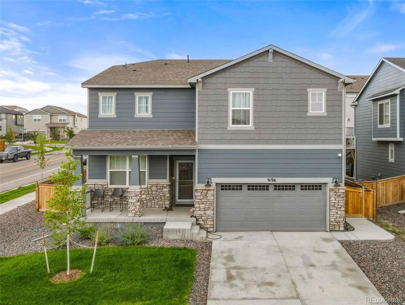 Front exterior of a new home in Buffalo Highlands: The Canyon Collection, Commerce City, CO, highlighting curb appeal (Image 2).