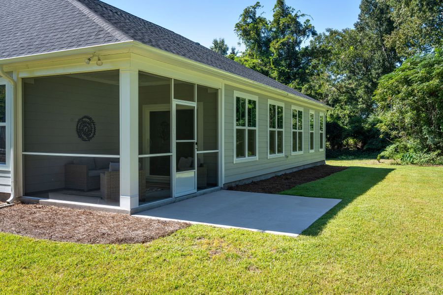 Exterior details and patio area of a home in The Bluffs at Lake Waccamaw, Lake Waccamaw (Image 26).
