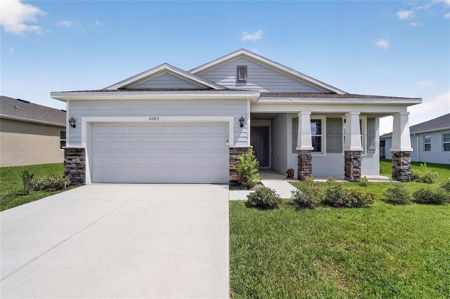 Front exterior of a new home in , Ocala, FL, highlighting curb appeal (Image 2). Front exterior of a new home in , Ocala, FL, highlighting curb appeal (Image 2).