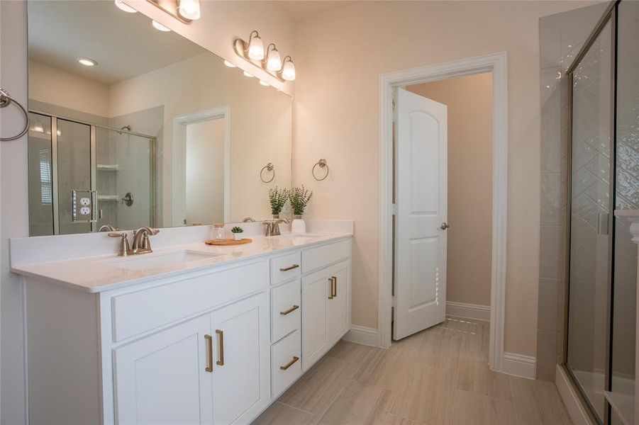 Bathroom with vanity and an enclosed shower