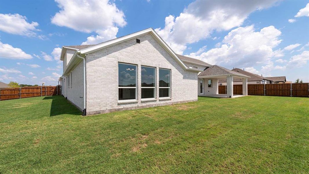 Front exterior of a new home in Terraces 82'/100', Rockwall, TX, highlighting curb appeal (Image 2). Front exterior of a new home in Terraces 82'/100', Rockwall, TX, highlighting curb appeal (Image 2).