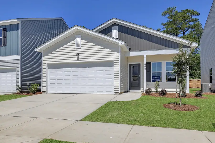 Front exterior of a new home in River Tide Farms, Bolivia, NC, highlighting curb appeal (Image 1). Front exterior of a new home in River Tide Farms, Bolivia, NC, highlighting curb appeal (Image 1).