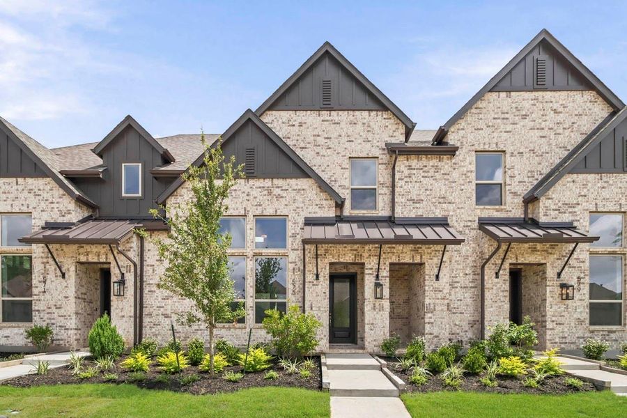 Front exterior of a new home in Woodforest Townhomes, Montgomery, TX, highlighting curb appeal (Image 1). Front exterior of a new home in Woodforest Townhomes, Montgomery, TX, highlighting curb appeal (Image 1).
