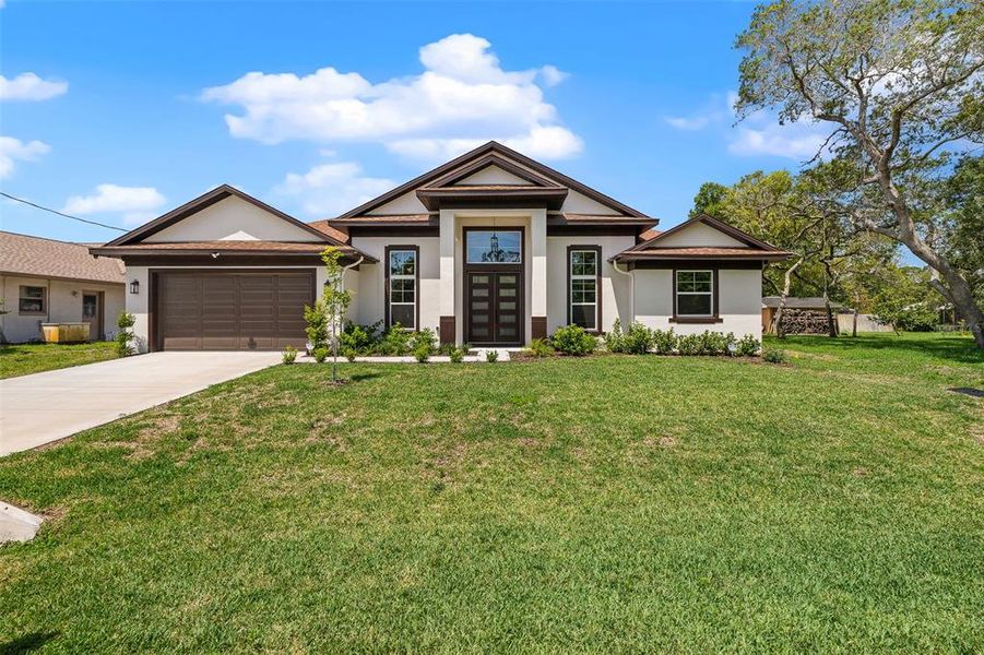 Front exterior of a new home in , Palm Coast, FL, highlighting curb appeal (Image 23). Front exterior of a new home in , Palm Coast, FL, highlighting curb appeal (Image 23).