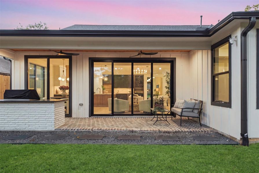 Covered rear patio extends the living space outdoors and creates an ideal setting for year-round entertaining.