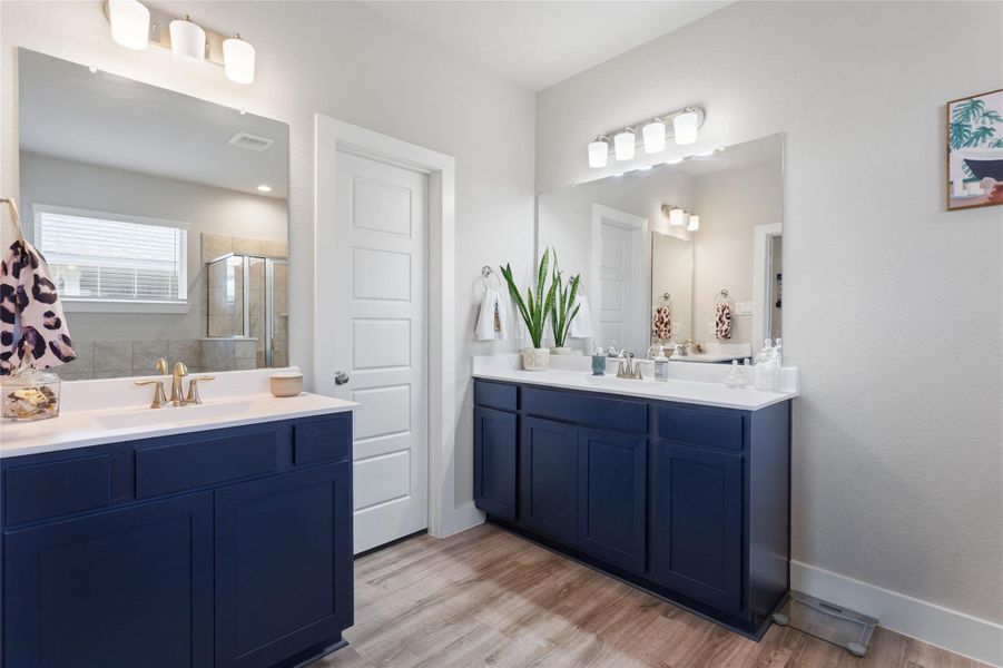 Spacious primary bathroom featuring dual sinks for convenience and style. Spacious primary bathroom featuring dual sinks for convenience and style.