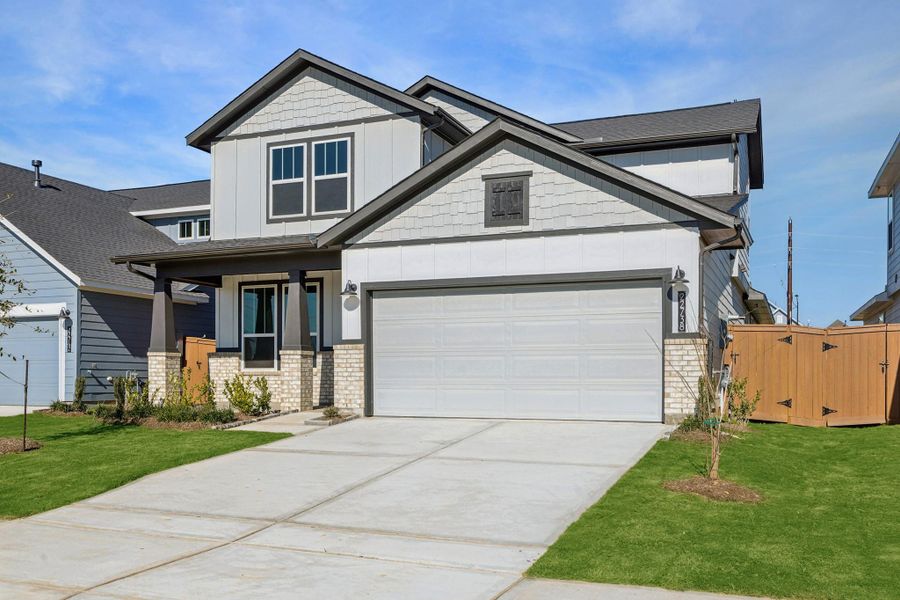 Front exterior of a new home in Elyson, Katy, TX, highlighting curb appeal (Image 2). Front exterior of a new home in Elyson, Katy, TX, highlighting curb appeal (Image 2).