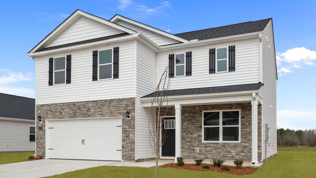 Front exterior of a new home in East Ridge, Ayden, NC, highlighting curb appeal (Image 19). Front exterior of a new home in East Ridge, Ayden, NC, highlighting curb appeal (Image 19).