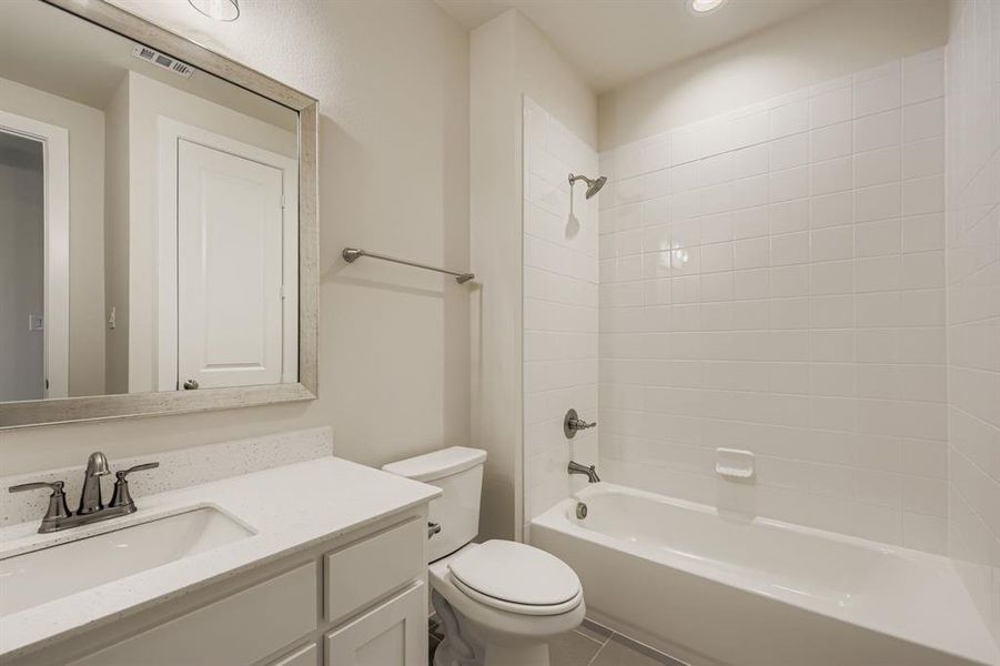 Bathroom with  shower combination, vanity, tile patterned flooring, and recessed lighting