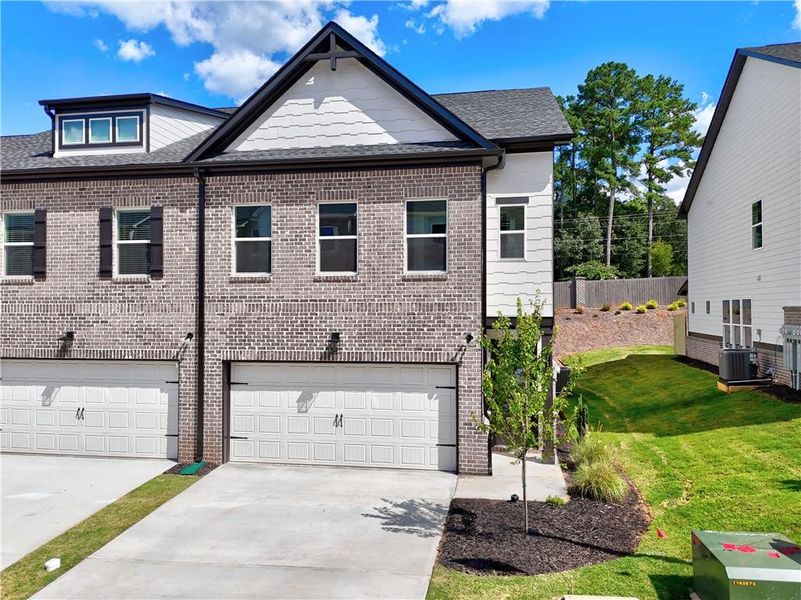 Front exterior of a new home in , Tucker, GA, highlighting curb appeal (Image 1).