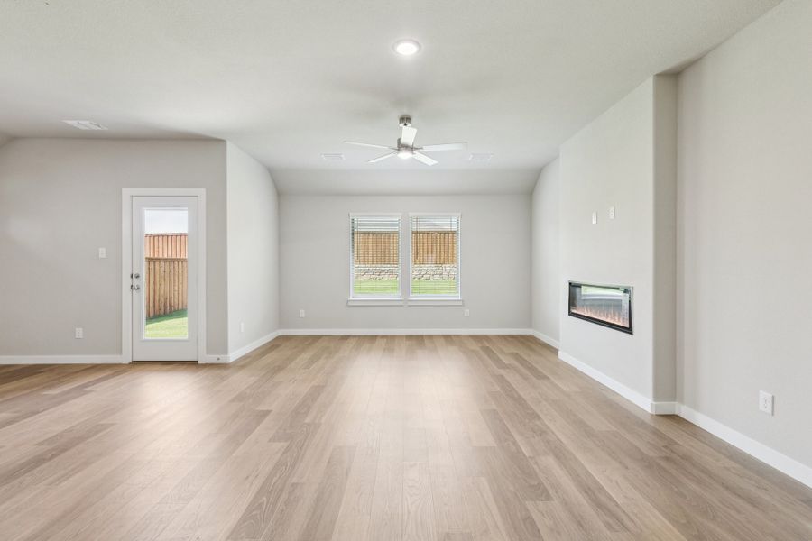 Living room in the Heisman home plan by Trophy Signature Homes – REPRESENTATIVE PHOTO