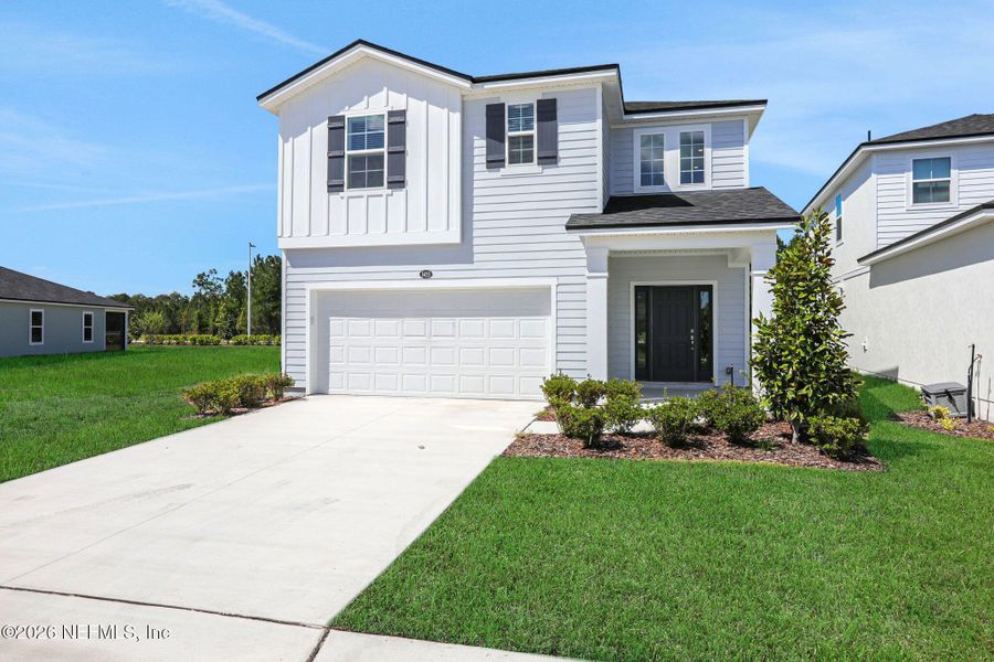 Front exterior of a new home in Amberly, Green Cove Springs, FL, highlighting curb appeal (Image 25).