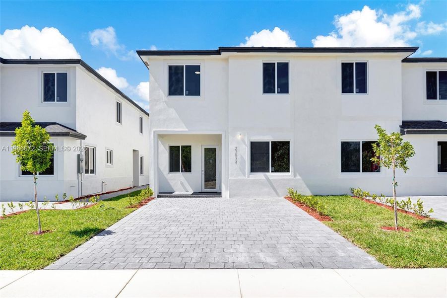 Front exterior of a new home in , Miami, FL, highlighting curb appeal (Image 26).