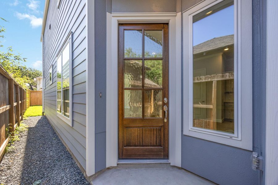 Step Inside: A welcoming 8-foot door greets your guests, or send friends through to the back if the BBQ has already started! Step Inside: A welcoming 8-foot door greets your guests, or send friends through to the back if the BBQ has already started!