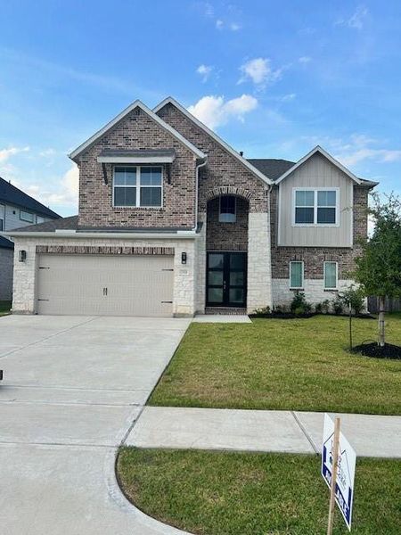 Front exterior of a new home in Morton Creek Ranch, Katy, TX, highlighting curb appeal (Image 1). Front exterior of a new home in Morton Creek Ranch, Katy, TX, highlighting curb appeal (Image 1).