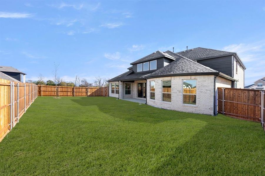 Exterior details and patio area of a home in Valencia on The Lake, Little Elm (Image 23).
