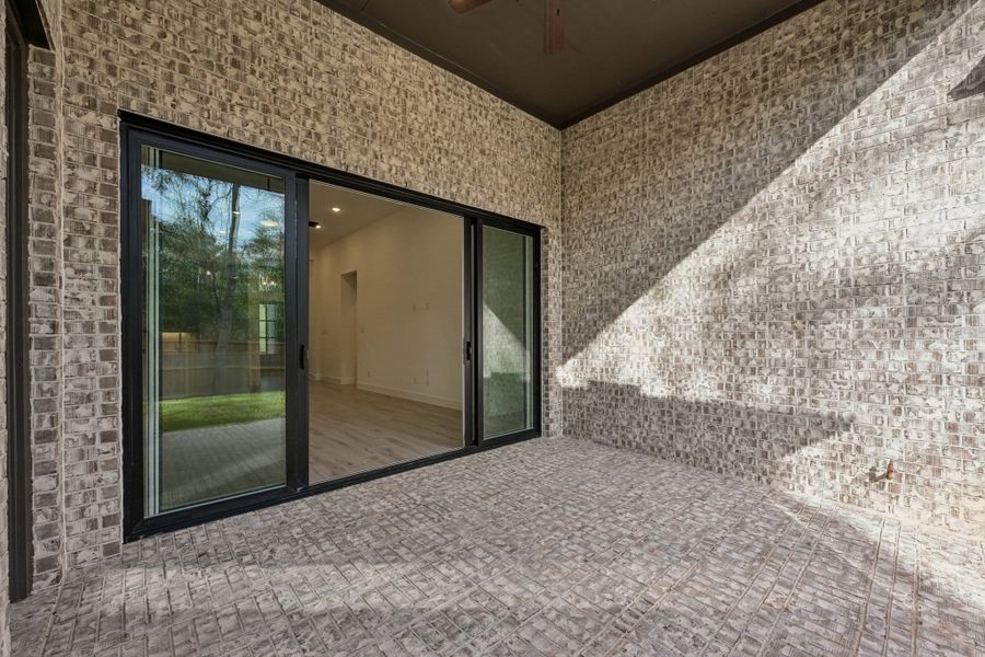 Exterior details and patio area of a home in Wood Leaf Reserve, Tomball (Image 27).