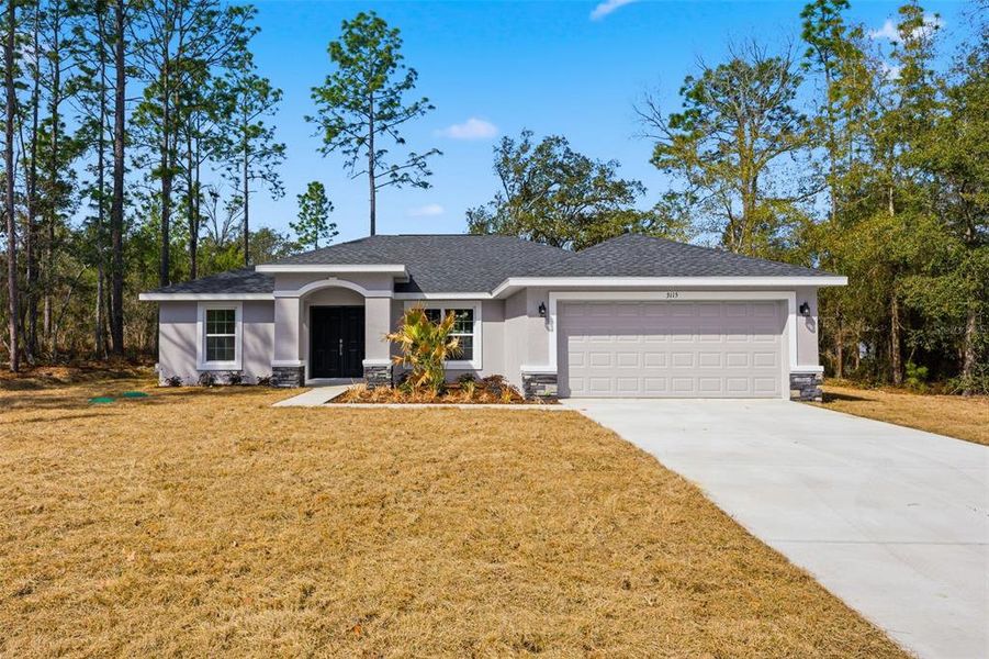 Front exterior of a new home in , Citrus Springs, FL, highlighting curb appeal (Image 28). Front exterior of a new home in , Citrus Springs, FL, highlighting curb appeal (Image 28).
