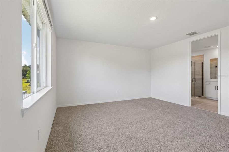 Spacious, unfurnished interior of a new home in The Grove at Stuart Crossing - Signature Series, Bartow (Image 31).
