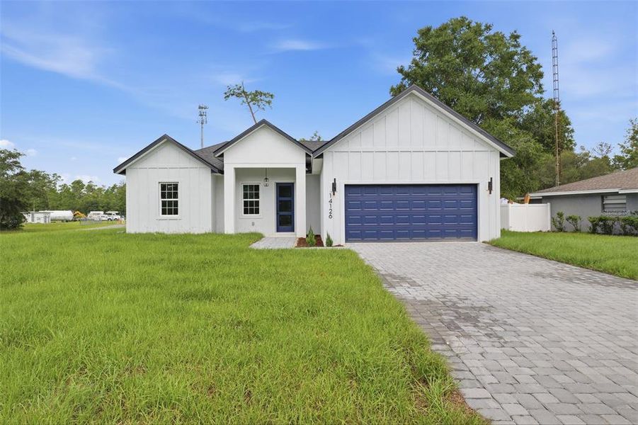 Front exterior of a new home in , Ocala, FL, highlighting curb appeal (Image 20).