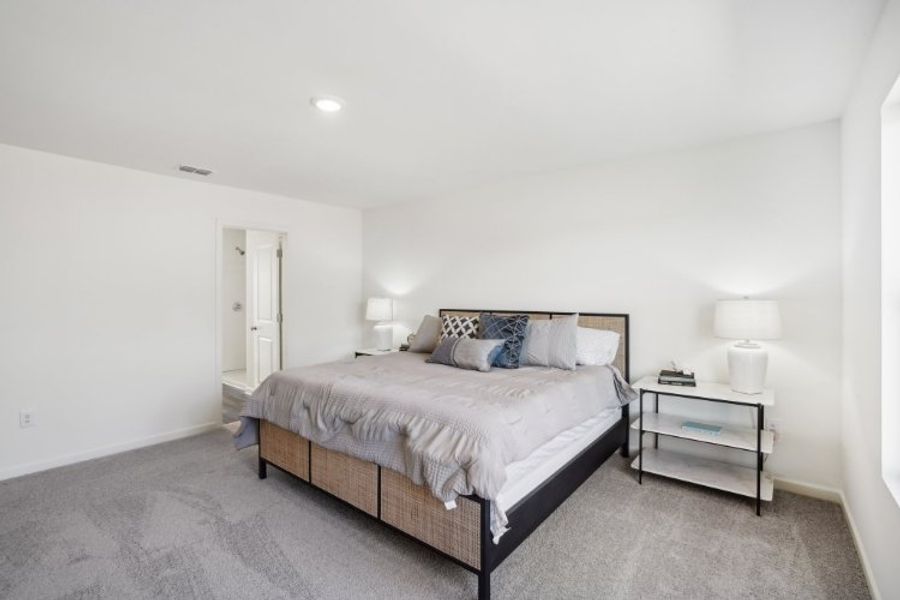 A bed in a room. A bed in a room.