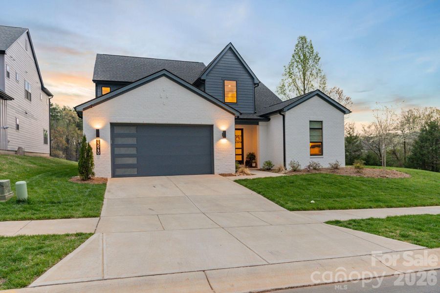 Front exterior of a new home in Amara Chase, Huntersville, NC, highlighting curb appeal (Image 24).