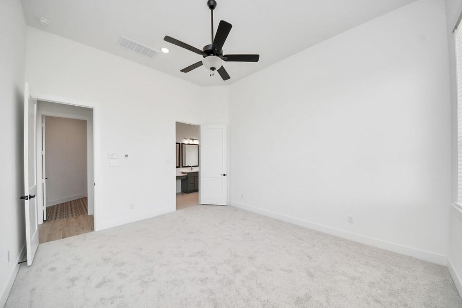 Spacious, unfurnished interior of a new home in Meridiana Courtyard Collection, Manvel (Image 27).