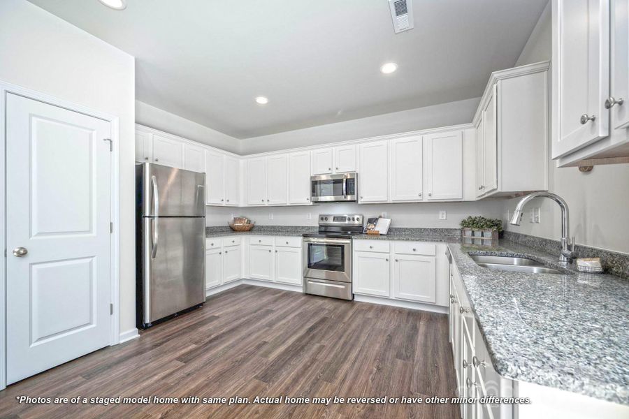 Kitchen with granite countertops and stainless appliances