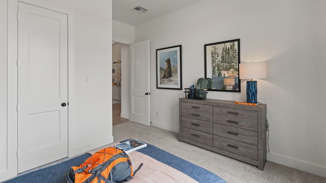 Representative furnished interior of a home built from the Hillcrest by Chesmar Homes in Artavia, Conroe (Image 17).