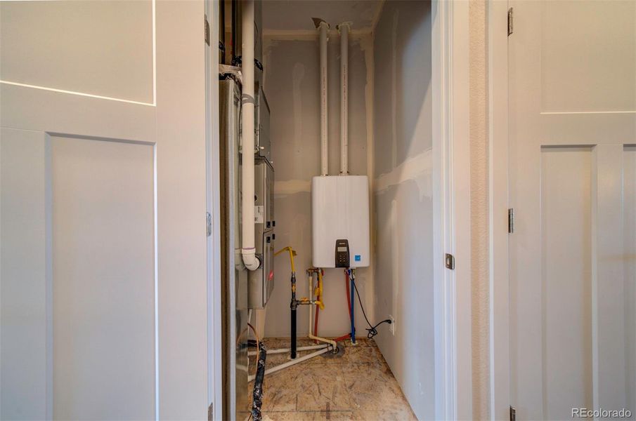 High efficiency gas furnace and tankless gas water heater serve the home.