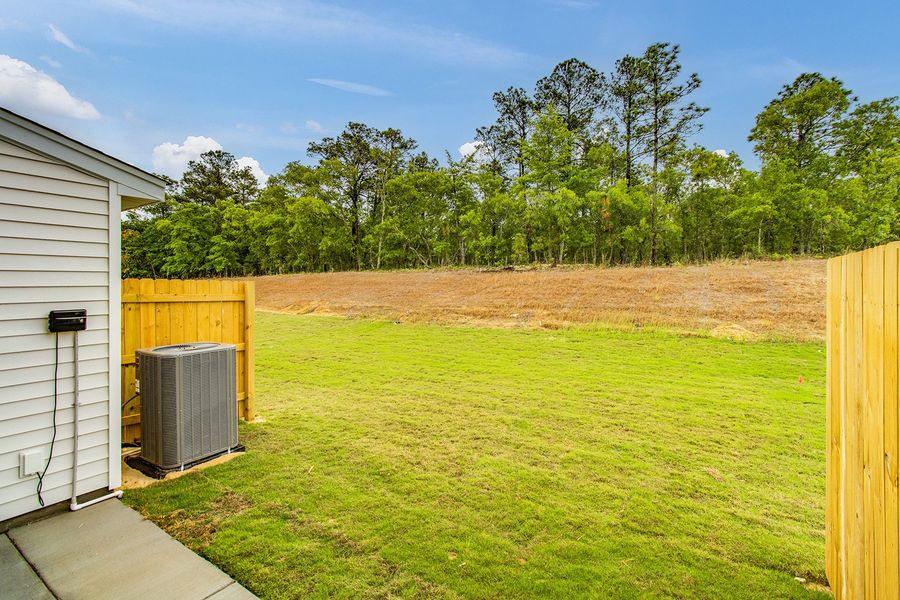 Exterior details and patio area of a home in Padgett Commons, Hopkins (Image 4).