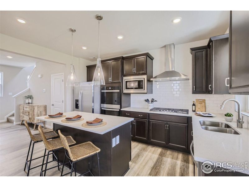 Spacious kitchen with an abundance of storage - Same Floor Plan, Different Model.