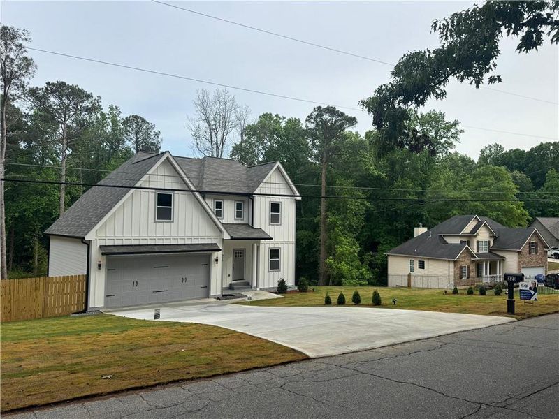Front exterior of a new home in , Mableton, GA, highlighting curb appeal (Image 18).