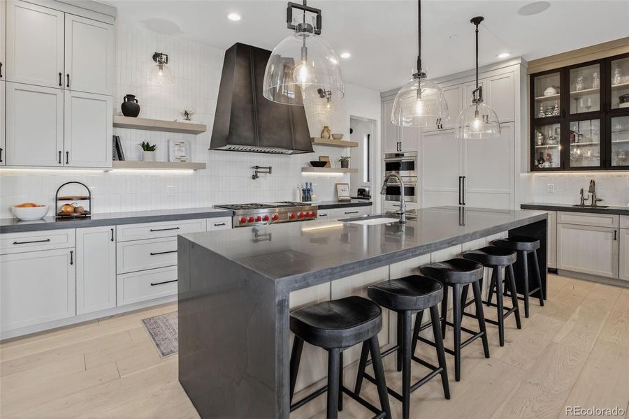 Chef's Kitchen with custom hood and cabinetry Chef's Kitchen with custom hood and cabinetry