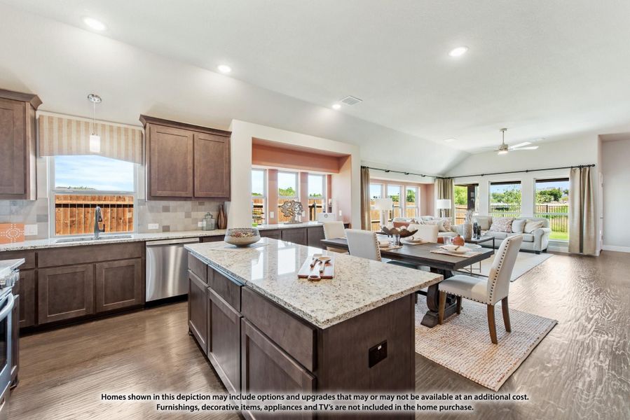 Open-concept kitchen with dark wood cabinets, granite island, and view into dining and living areas with hardwood floors. Open-concept kitchen with dark wood cabinets, granite island, and view into dining and living areas with hardwood floors.