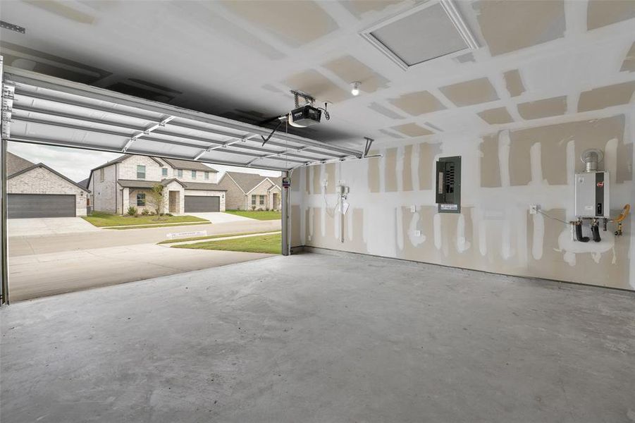 Garage with electric panel, a garage door opener, and a residential view Garage with electric panel, a garage door opener, and a residential view