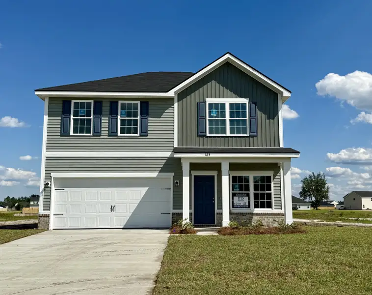 Front exterior of a new home in The Village at Sassafras, Allenhurst, GA, highlighting curb appeal (Image 1). Front exterior of a new home in The Village at Sassafras, Allenhurst, GA, highlighting curb appeal (Image 1).