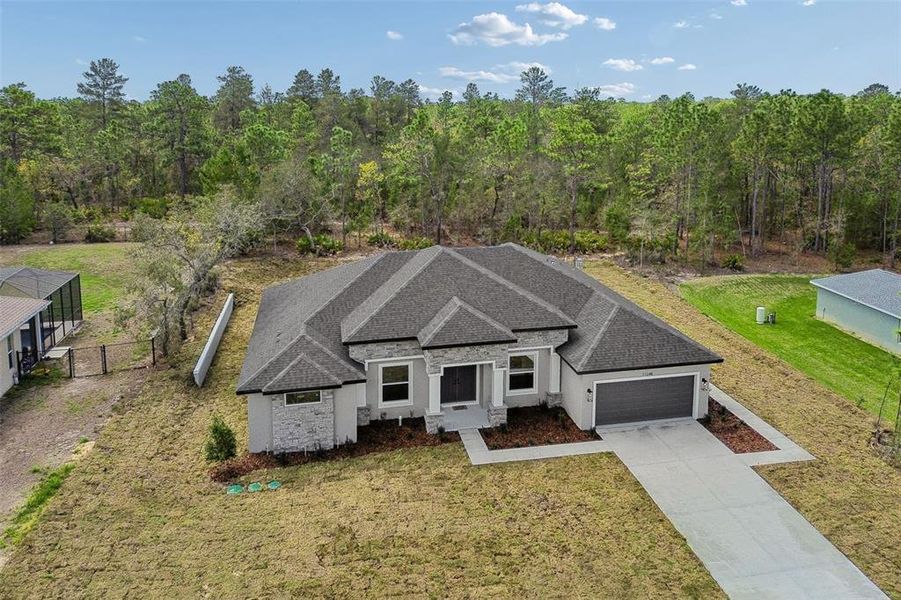 Front exterior of a new home in , Weeki Wachee, FL, highlighting curb appeal (Image 27).
