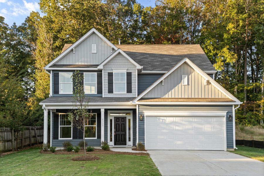 Front exterior of a new home in Chandler Ridge, McLeansville, NC, highlighting curb appeal (Image 1).