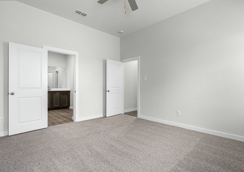 The master suite has a large bedroom, ensuite bathroom and a walk-in closet.